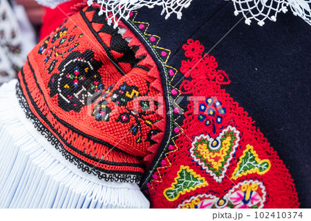Details of costumes during traditional moravian festival in czech Details of costumes during traditional moravian festival in czech 102410374