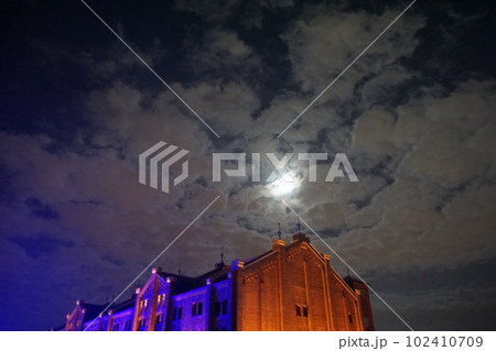Yokohama Red Brick Warehouse building. Bright moon in the night sky Yokohama Red Brick Warehouse building. Bright moon in the night sky 102410709