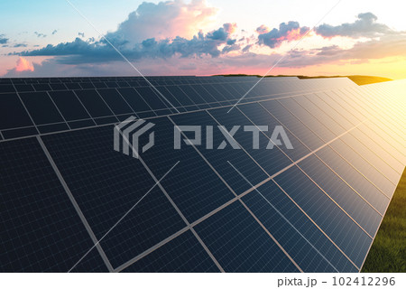 Rows of solar panels in a field on a background of green grass. Ground power plant of alternative electricity 102412296