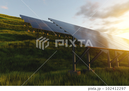 Rows of solar panels in a field on a background of green grass. Ground power plant of alternative electricity 102412297