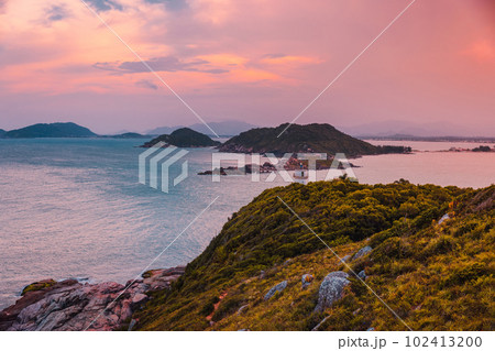 Aerial view of coastline with lighthouse, sunset and ocean in Brazil Aerial view of coastline with lighthouse, sunset and ocean in Brazil 102413200