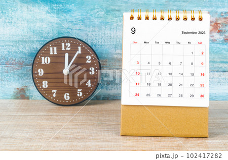 The September 2023 Monthly desk calendar for 2023 year and clock. 102417282