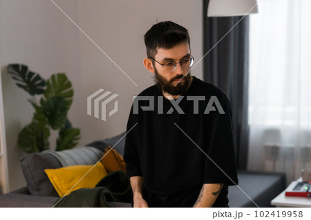 Sad man pondering about his life after a relationship breakup or bipolar disorder copy space - depression asthenia , mental problem and anxiety disorder concept 102419958