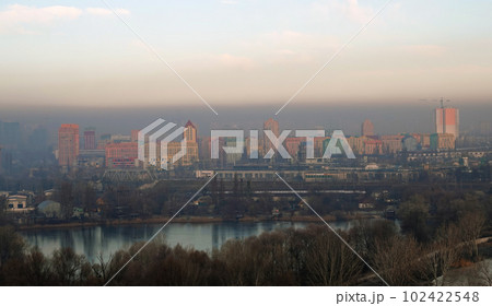 Kiev, Ukraine January 8, 2020: Strong black smog over the buildings and quarters of Kiev Kiev, Ukraine January 8, 2020: Strong black smog over the buildings and quarters of Kiev 102422548