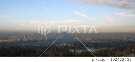Kiev, Ukraine January 8, 2020: Strong black smog over the buildings and quarters of Kiev Kiev, Ukraine January 8, 2020: Strong black smog over the buildings and quarters of Kiev 102422553