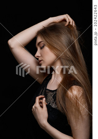 gorgeous brunette woman with long hair in black dress gorgeous brunette woman with long hair in black dress 102422643
