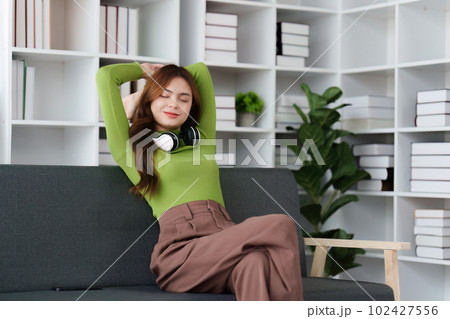 Attractive Asian woman resting comfortable living room and using mobile phone, Relax, Sofa, Lifestyle Attractive Asian woman resting comfortable living room and using mobile phone, Relax, Sofa, Lifestyle 102427556