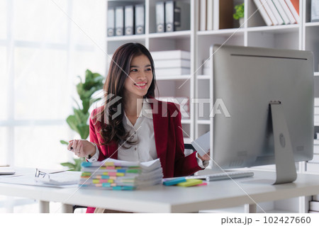 Accountant asian woman working on laptop and do document, tax, exchange, accounting and Financial advisor concept Accountant asian woman working on laptop and do document, tax, exchange, accounting and Financial advisor concept 102427660