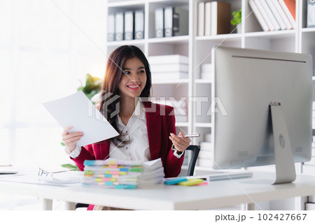 Accountant asian woman working on laptop and do document, tax, exchange, accounting and Financial advisor concept 102427667