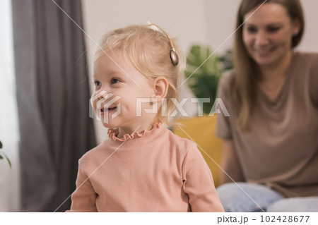 Deaf kid with hearing aid cochlear implant have fun with parents - Hear aid and medicine innovating technology and diversity concept 102428677