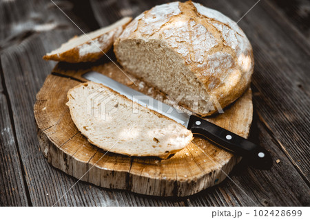 Traditional sourdough bread, sliced and ready to eat Traditional sourdough bread, sliced and ready to eat 102428699