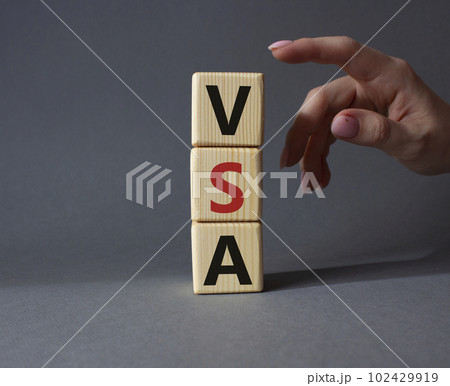 VSA - Volume Spread Analysis symbol. Wooden cubes with word VSA. Businessman hand. Beautiful grey background. Business and Volume Spread Analysis concept. Copy space. VSA - Volume Spread Analysis symbol. Wooden cubes with word VSA. Businessman hand. Beautiful grey background. Business and Volume Spread Analysis concept. Copy space. 102429919