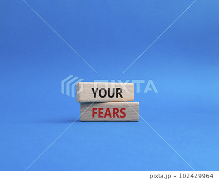 Your fears symbol. Wooden blocks with words Your fears. Beautiful blue background. Business and Your fears concept. Copy space. Your fears symbol. Wooden blocks with words Your fears. Beautiful blue background. Business and Your fears concept. Copy space. 102429964