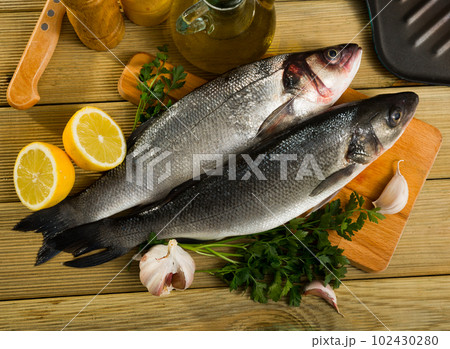 Sea basses on cutting board 102430280