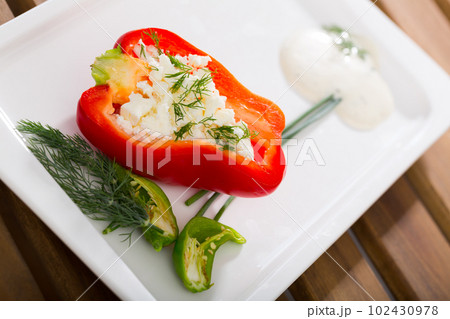 Stuffed delicious half of red pepper with brynza, Bulgarian cuisine 102430978