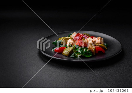 Delicious fresh salad of zucchini, cheese, sweet peppers, spinach with spices and herbs Delicious fresh salad of zucchini, cheese, sweet peppers, spinach with spices and herbs 102431061