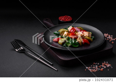 Delicious fresh salad of zucchini, cheese, sweet peppers, spinach with spices and herbs Delicious fresh salad of zucchini, cheese, sweet peppers, spinach with spices and herbs 102431071