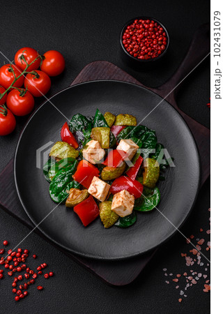 Delicious fresh salad of zucchini, cheese, sweet peppers, spinach with spices and herbs Delicious fresh salad of zucchini, cheese, sweet peppers, spinach with spices and herbs 102431079