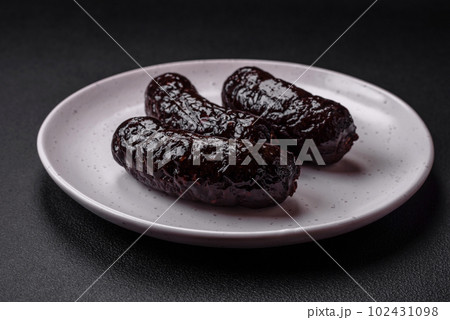 Delicious black blood sausage or black pudding with spices and herbs Delicious black blood sausage or black pudding with spices and herbs 102431098