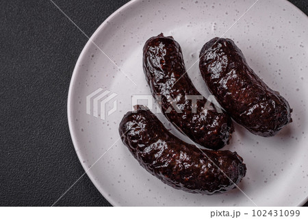 Delicious black blood sausage or black pudding with spices and herbs 102431099