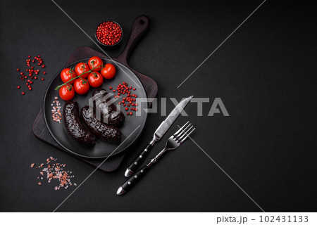 Delicious black blood sausage or black pudding with spices and herbs 102431133