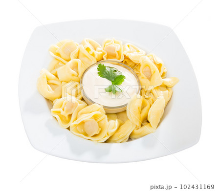 Ravioli with creamy sauce 102431169