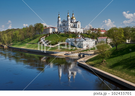 Old ancient Holy Assumption Cathedral on the embankment of the Western Dvina river, Vitebsk, Belarus. Old ancient Holy Assumption Cathedral on the embankment of the Western Dvina river, Vitebsk, Belarus. 102433701