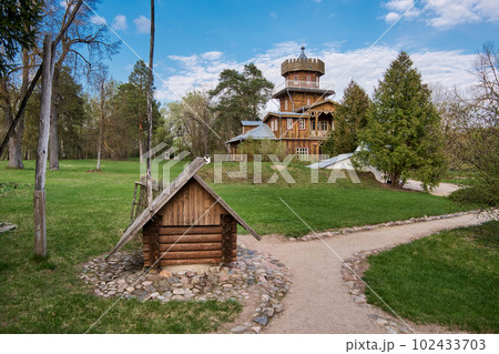 Zdravnevo, Vitebsk region, Belarus. The place near the Western Dvina River, where the painter Ilya Repin lived and rested in the summer. wooden well in the foreground. 102433703