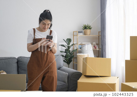 Modern female people in moving home apartment leisure indoor activity alone. Modern female people in moving home apartment leisure indoor activity alone. 102443325