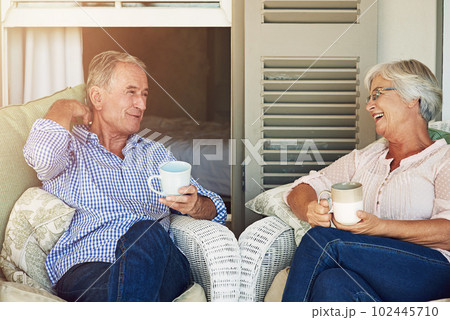 Spending their retirement in love. a senior couple sitting outdoors. Spending their retirement in love. a senior couple sitting outdoors. 102445710