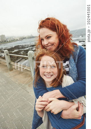 Our time together is priceless. a mature woman and her young daughter at the waterfront. 102445801