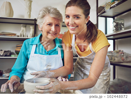 Time to play with clay. a senior woman making a ceramic pot at a pottery class. Time to play with clay. a senior woman making a ceramic pot at a pottery class. 102448072