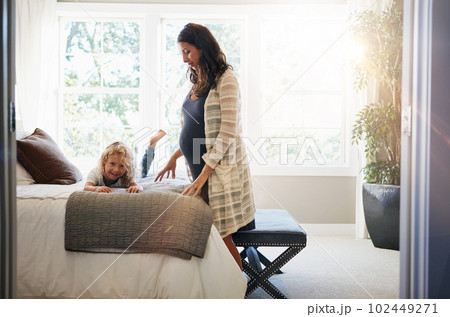 Hes excited to be a big brother. a pregnant woman bonding with her little son at home. Hes excited to be a big brother. a pregnant woman bonding with her little son at home. 102449271