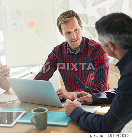 Working together on a online project. businesspeople meeting in an office. 102449850