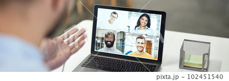 Boss conducting online meeting with his employees Boss conducting online meeting with his employees 102451540
