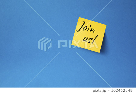 Join us symbol. Concept word Join us on orange steaky note. Beautiful blue background. Business and Join us concept. Copy space 102452349
