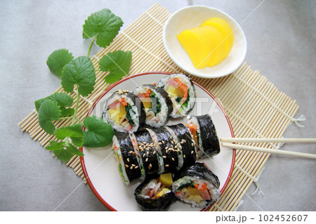 Korean roll Gimbap(kimbob) made from steamed white rice (bap) and various other ingredients 102452607
