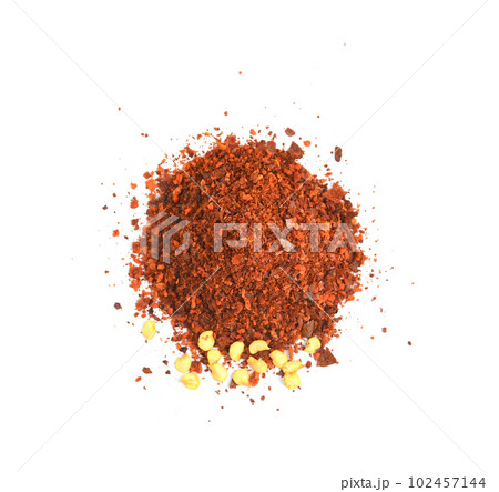 dried red chili flakes and seeds isolated on white background, top view dried red chili flakes and seeds isolated on white background, top view 102457144