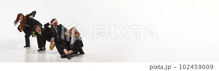 Banner with busy business women, office workers in suit starting talking via telephones over white studio background. Working process Banner with busy business women, office workers in suit starting talking via telephones over white studio background. Working process 102459009