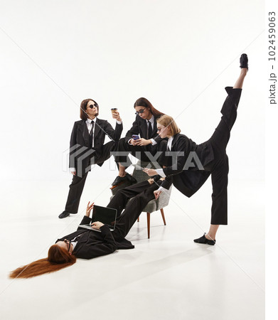 Portrait with group of businesswomen, ballet dancers in classical costume working on white background. Business ballerinas Portrait with group of businesswomen, ballet dancers in classical costume working on white background. Business ballerinas 102459063