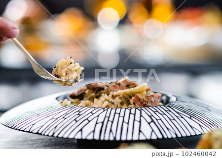 Plate with risotto on a restaurant 102460042