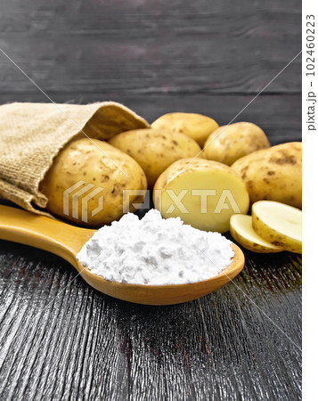 Starch potato in spoon on table Starch potato in spoon on table 102460223