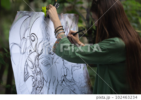 a girl draws a close-up of a beautiful and seductive woman on canvas, drawing something modern and majestic on her white canvas a girl draws a close-up of a beautiful and seductive woman on canvas, drawing something modern and majestic on her white canvas 102463234