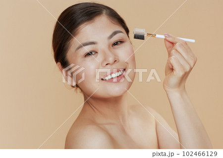 modern woman with brow brush 102466129