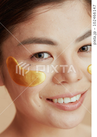 young asian woman with eye patches 102466147