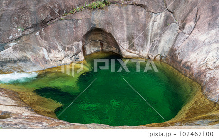 Stunning natural pool in the middle of a rocky cliff Stunning natural pool in the middle of a rocky cliff 102467100
