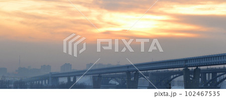 city at dusk, city buildings against the sky, polluted air, poor ecology, railway bridge city at dusk, city buildings against the sky, polluted air, poor ecology, railway bridge 102467535