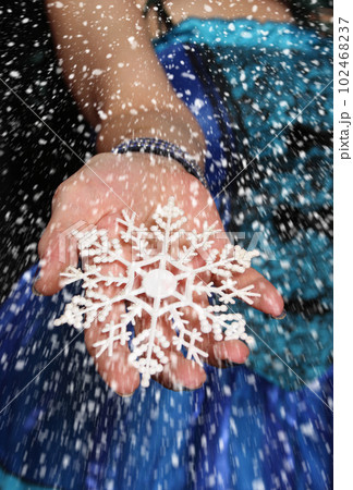Woman wearing Blue Corset with snowflake ornament and snow storm Woman wearing Blue Corset with snowflake ornament and snow storm 102468237