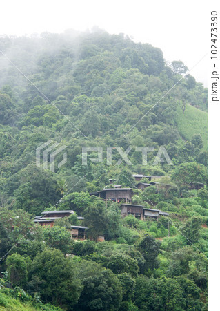 Landscape view of rice terraces and house of Thailand hill tribe. The village is in a valley among the rice terraces in Mae Jam, Chiang Mai, Thailand. Landscape view of rice terraces and house of Thailand hill tribe. The village is in a valley among the rice terraces in Mae Jam, Chiang Mai, Thailand. 102473390