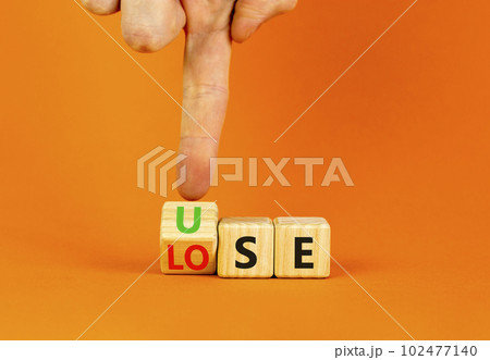 Use or lose symbol. Concept words Use or lose on wooden cubes. Businessman hand. Beautiful orange table orange background. Business Use or lose concept. Copy space. Use or lose symbol. Concept words Use or lose on wooden cubes. Businessman hand. Beautiful orange table orange background. Business Use or lose concept. Copy space. 102477140